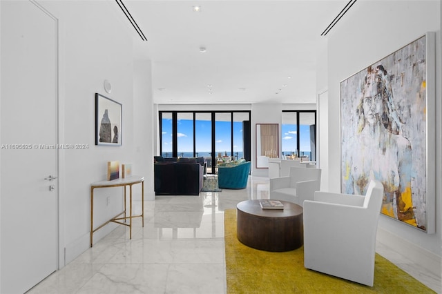 living room featuring floor to ceiling windows