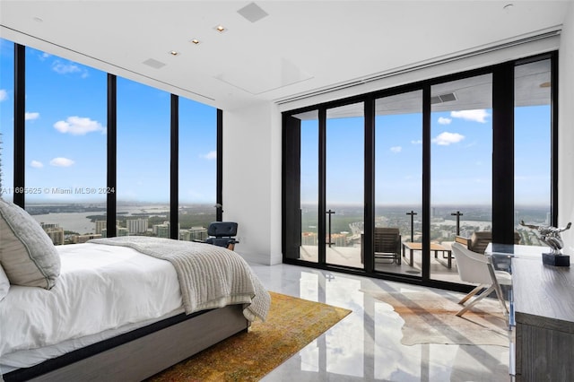 bedroom featuring floor to ceiling windows and multiple windows