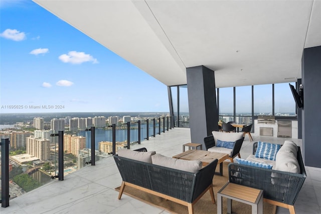 view of patio with an outdoor living space and a water view