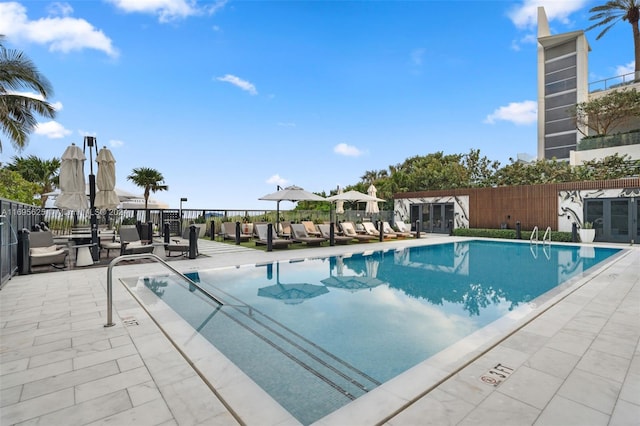 view of swimming pool with a patio