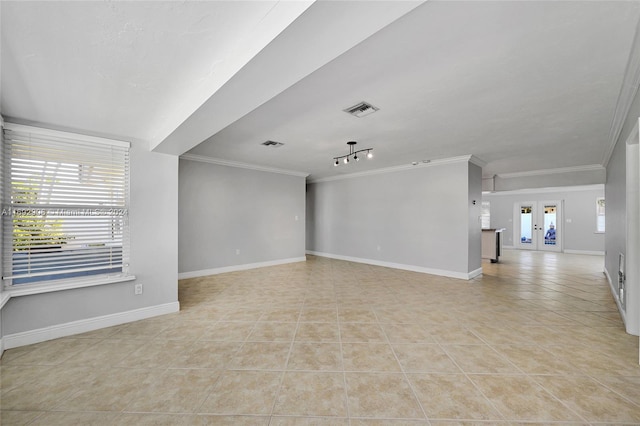 unfurnished living room featuring french doors, light tile patterned floors, and ornamental molding