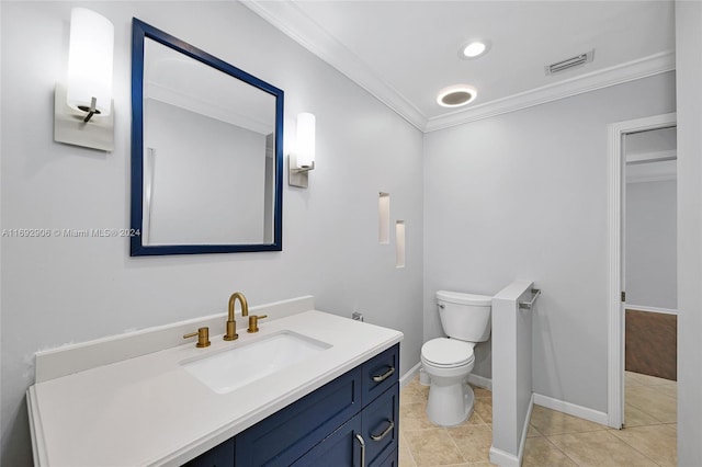 bathroom featuring tile patterned floors, vanity, toilet, and crown molding