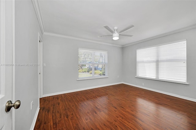 unfurnished room with ornamental molding, ceiling fan, and dark wood-type flooring