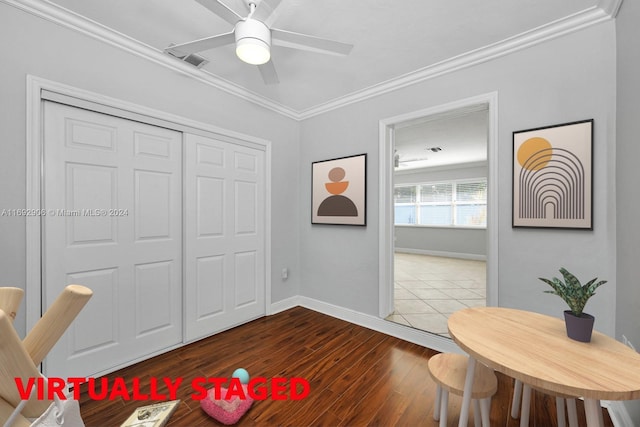 interior space featuring hardwood / wood-style floors, ceiling fan, and ornamental molding