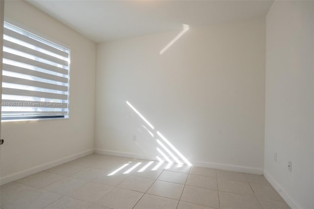 empty room featuring light tile patterned floors