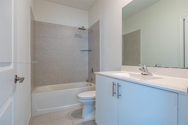 full bathroom with tile patterned flooring, tiled shower / bath combo, toilet, and vanity