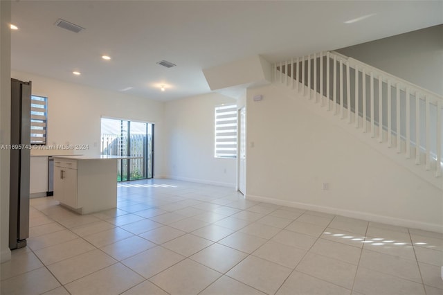 spare room with light tile patterned floors