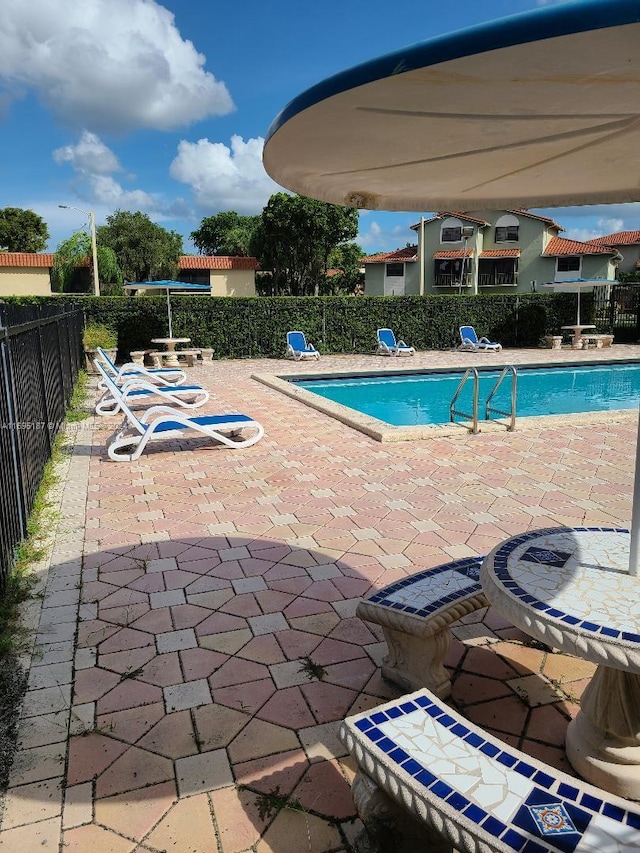 view of swimming pool featuring a patio