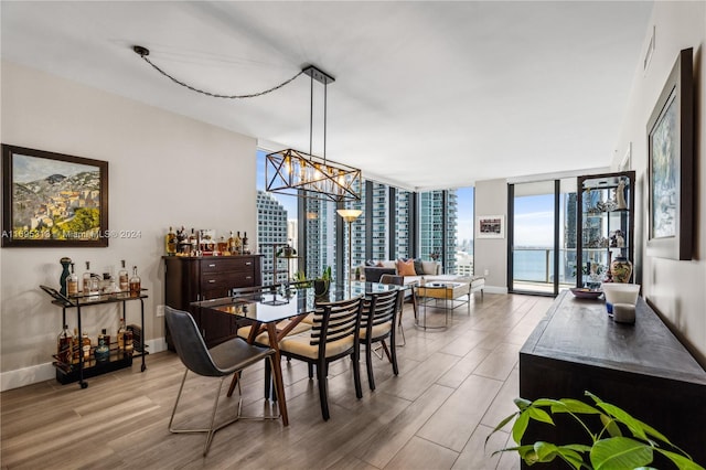 dining room featuring hardwood / wood-style floors and expansive windows