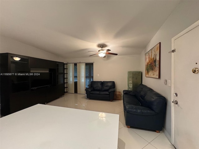 interior space with ceiling fan