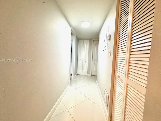 hall with light tile patterned flooring