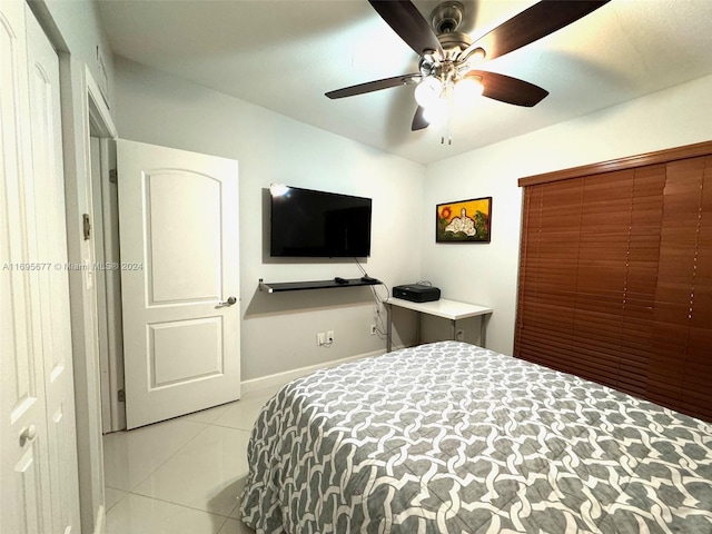 tiled bedroom with ceiling fan