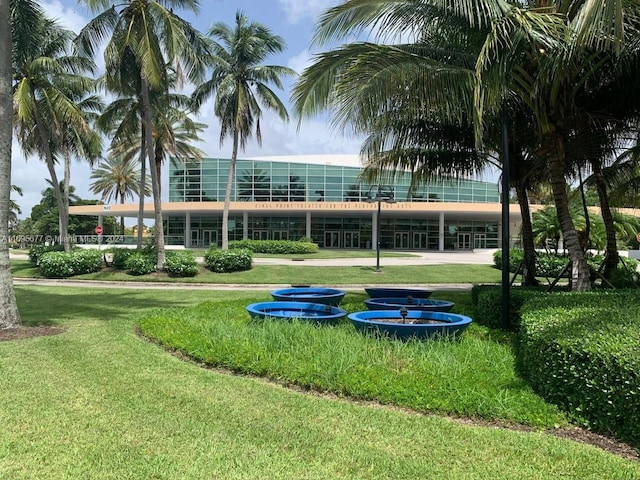 view of home's community with a lawn