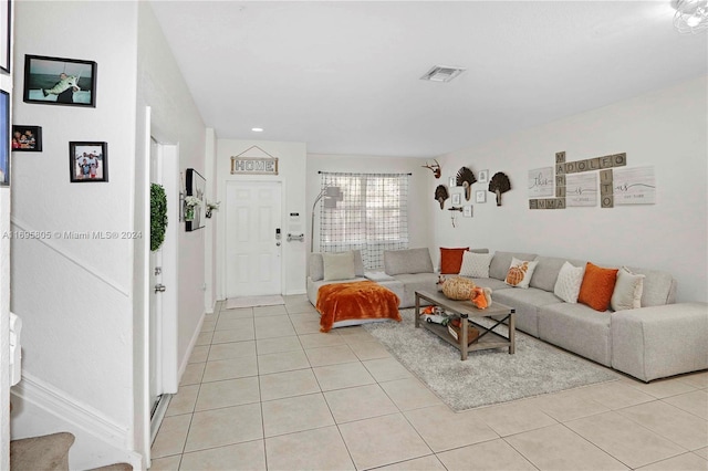 living room featuring light tile patterned flooring