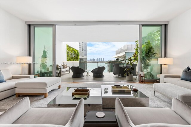 living room with floor to ceiling windows and a wealth of natural light