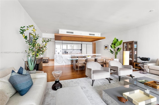 living room with light hardwood / wood-style floors