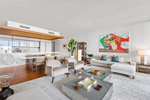 living room with light hardwood / wood-style flooring