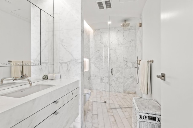 bathroom featuring radiator, vanity, a shower with shower door, and toilet