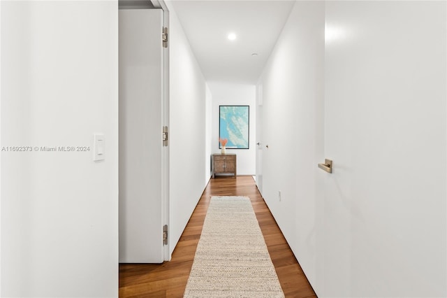 hall with light hardwood / wood-style floors