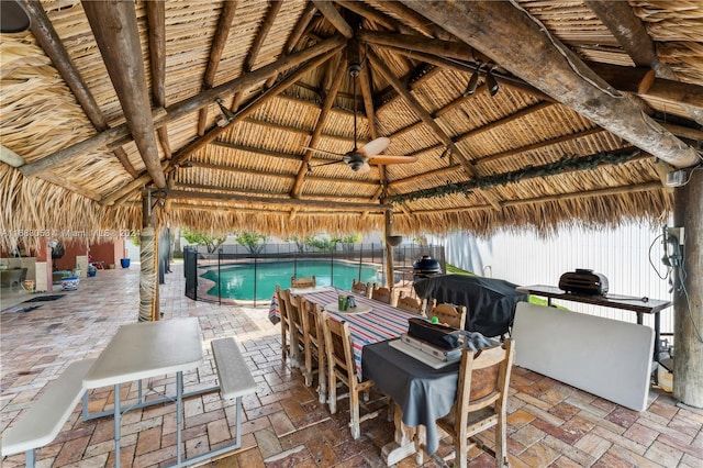 view of patio / terrace with a gazebo, ceiling fan, and area for grilling