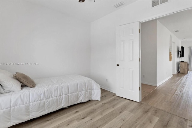 bedroom featuring ceiling fan and light hardwood / wood-style floors