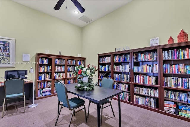 office space featuring light carpet and vaulted ceiling