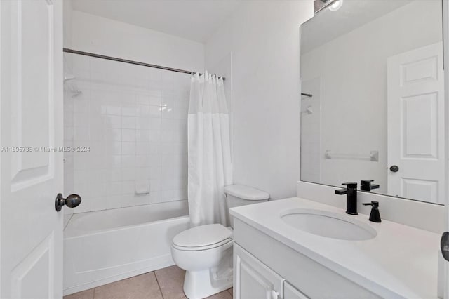 full bathroom featuring tile patterned flooring, vanity, shower / bath combo, and toilet