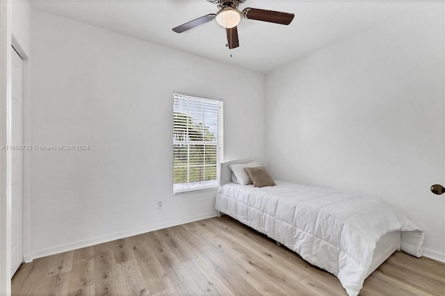 unfurnished bedroom featuring light hardwood / wood-style flooring and ceiling fan