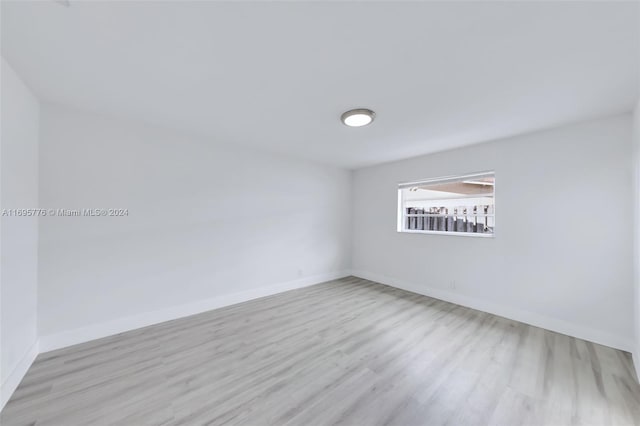 unfurnished room featuring light hardwood / wood-style flooring