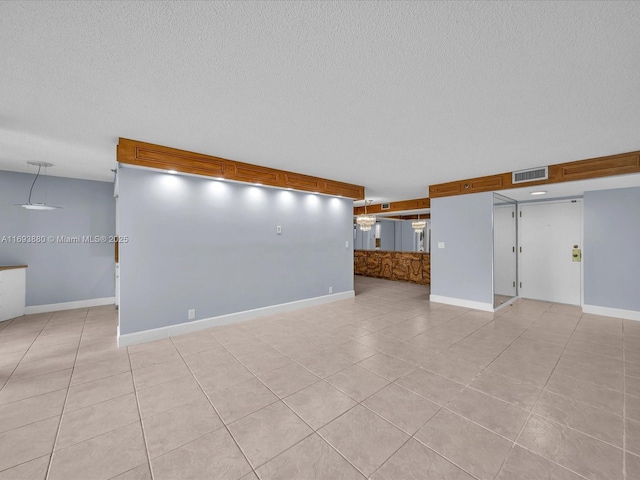 unfurnished living room featuring light tile patterned floors