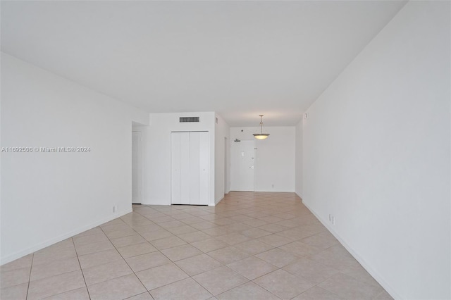 spare room with light tile patterned floors