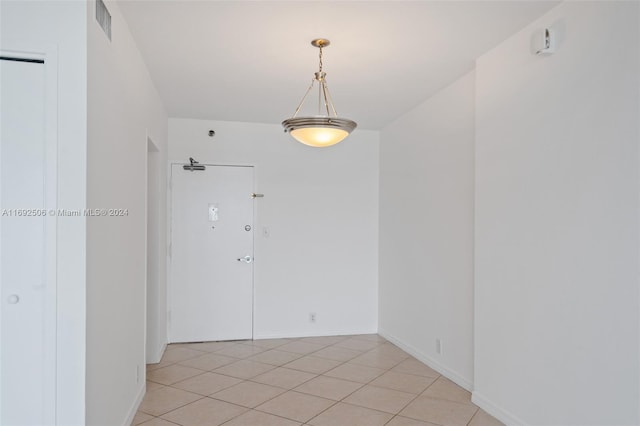 empty room featuring light tile patterned floors