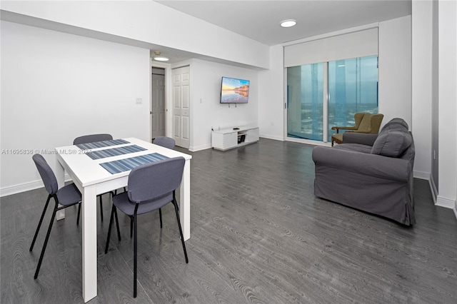 dining area featuring dark hardwood / wood-style flooring