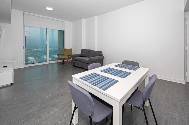 dining space with dark hardwood / wood-style floors