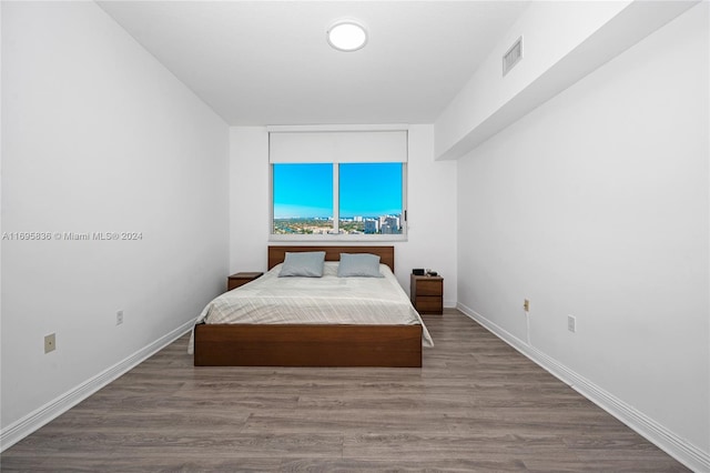 bedroom featuring hardwood / wood-style flooring