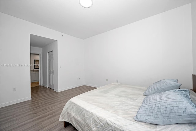 bedroom featuring wood-type flooring