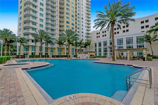 view of swimming pool with a patio