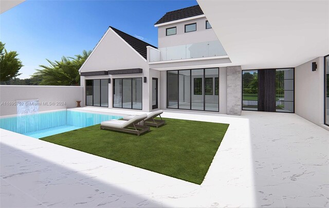 16684 SW 59th Ct, Southwest Ranches, FL 33331 - rear view of house featuring a patio, an outdoor pool, and stucco siding