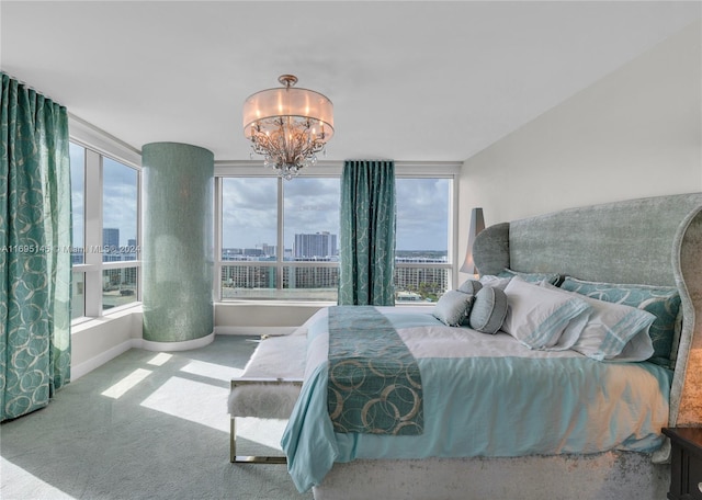 bedroom featuring carpet and an inviting chandelier