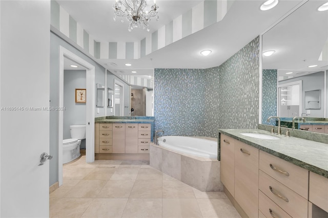 full bathroom featuring tile patterned floors, vanity, a notable chandelier, shower with separate bathtub, and toilet