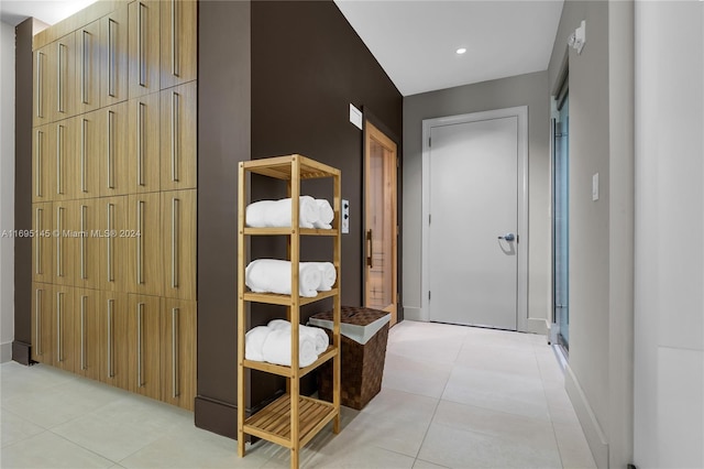 hallway with light tile patterned floors