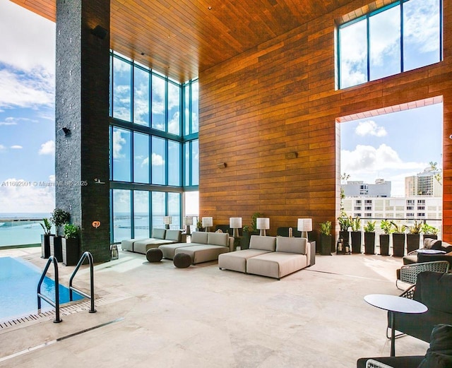 1451 Brickell Ave Unit 2706, Miami, FL 33131 - building lobby with a high ceiling, wooden walls, and wood ceiling