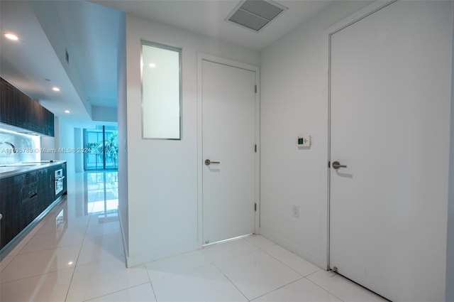 hallway with light tile patterned floors