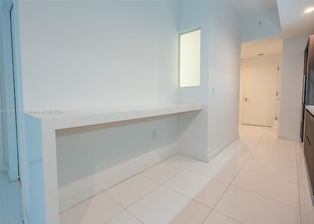 hallway featuring light tile patterned flooring