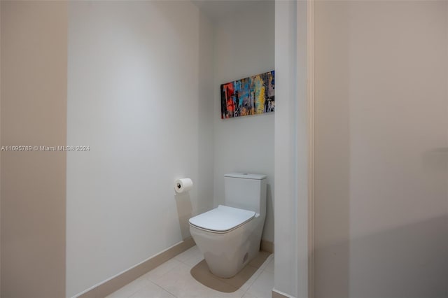 bathroom featuring tile patterned floors and toilet