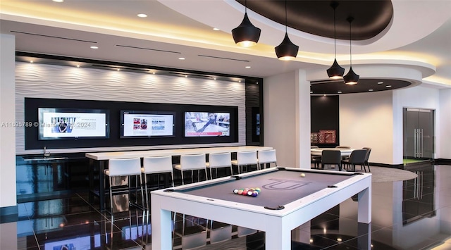 playroom featuring dark tile patterned floors, billiards, and a tray ceiling