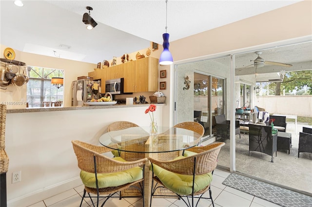 dining room featuring ceiling fan and light tile patterned floors