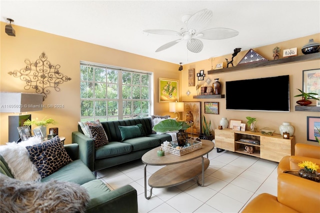 tiled living room with ceiling fan