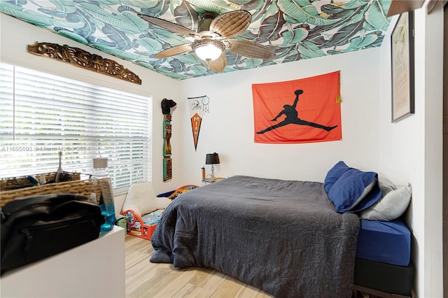 bedroom featuring hardwood / wood-style flooring and ceiling fan