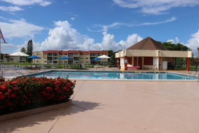 view of swimming pool with a patio